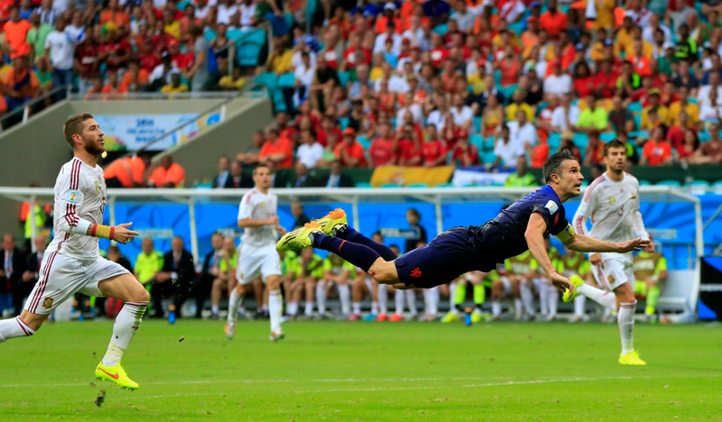 Illustration for article titled The Best Photos Of Robin Van Persie's Amazing Flying Header Goal